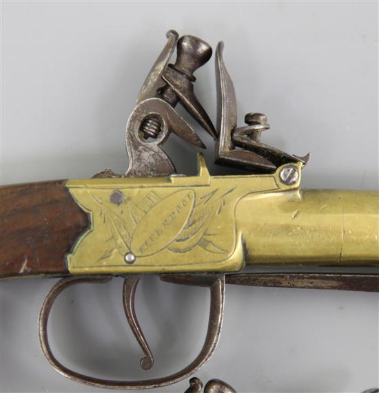 A pair of brass framed and barrelled flintlock boxlock pocket pistols, 8in. (11in with bayonet)